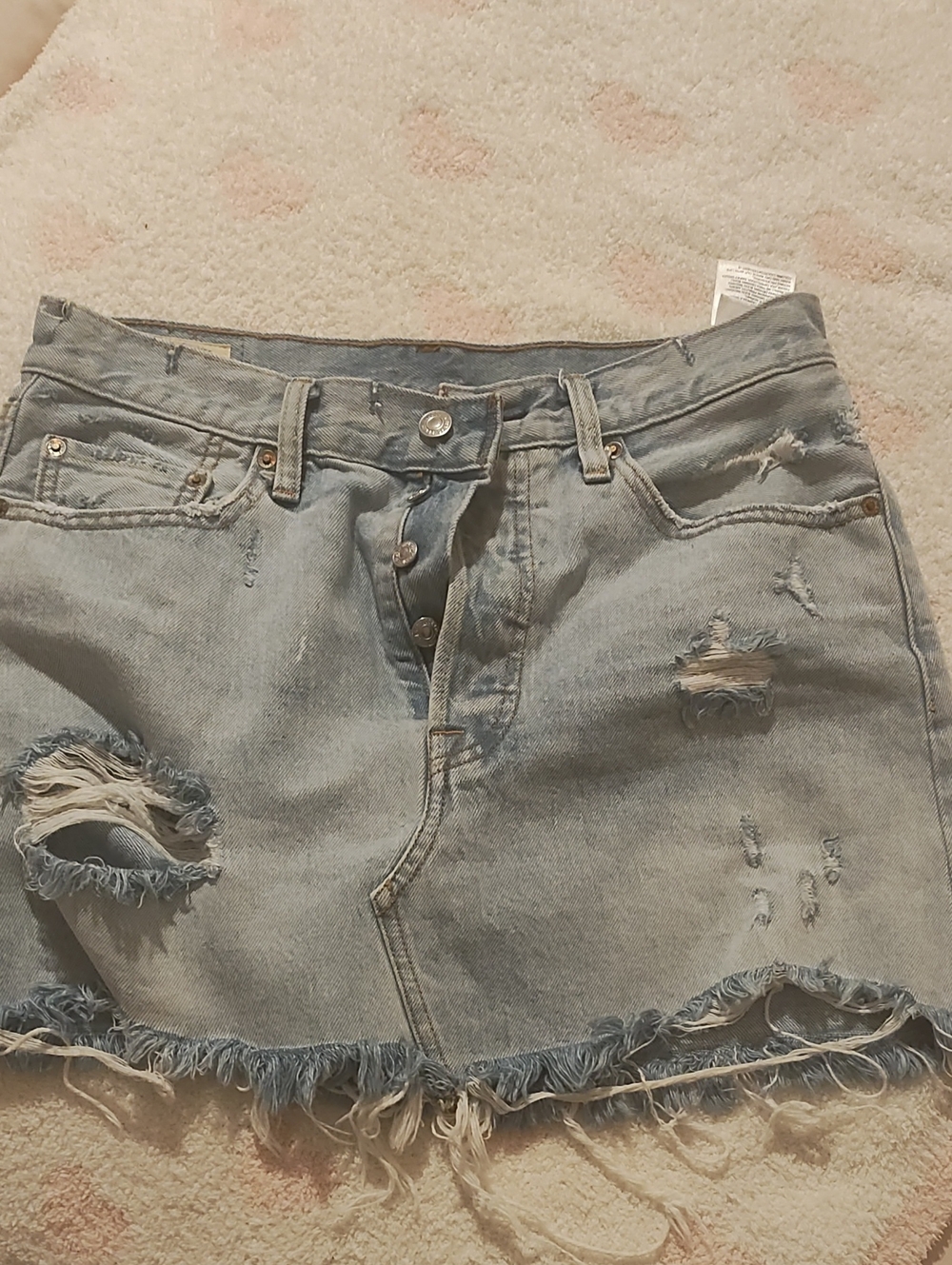 Levi's light blue distressed denim mini skirt